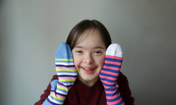 istock Cute smiling down syndrome girl 1305998739