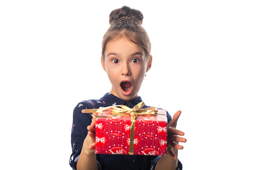 Female child receives a gift surprised and glad