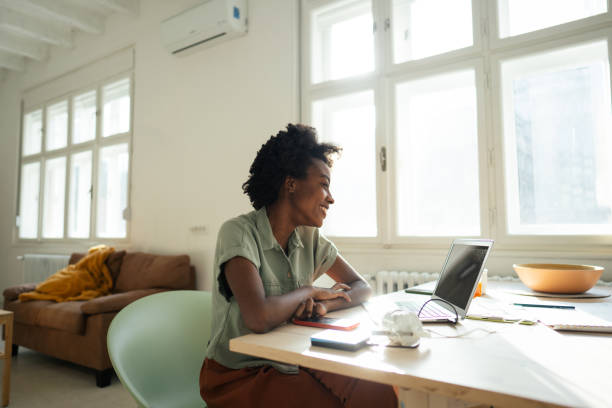 istock Millennial woman working in the new normal 1306002654