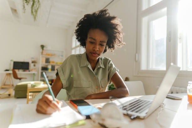 istock Millennial woman working in the new normal 1306002720