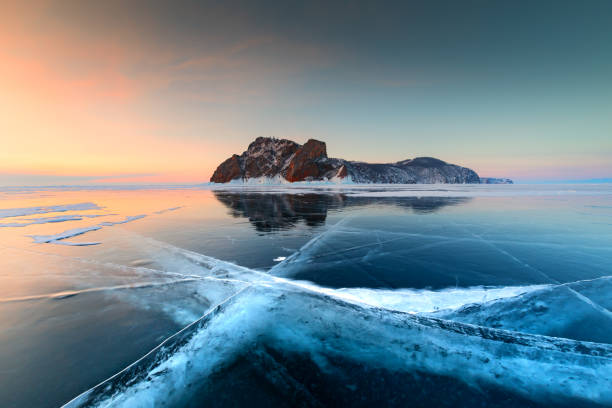 istock Baikal lake in winter with transparent blue ice. 1306003447