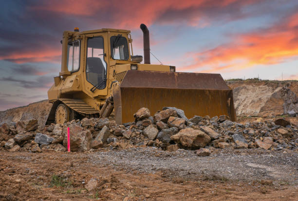 istock Excavator building a road in a site construction 1306004632
