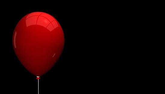 Empty Red Balloon With Light Reflections - Isolated On Black Background