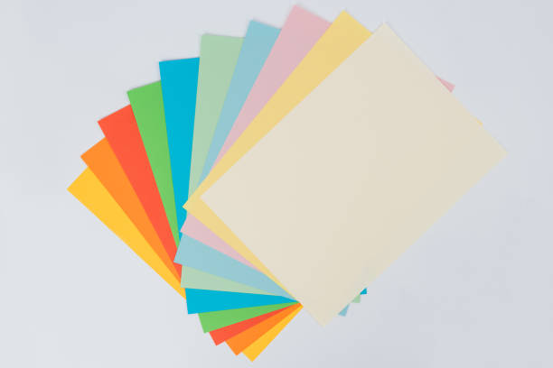istock laid out bright multicolored paper on white background, flat lay 1306007303