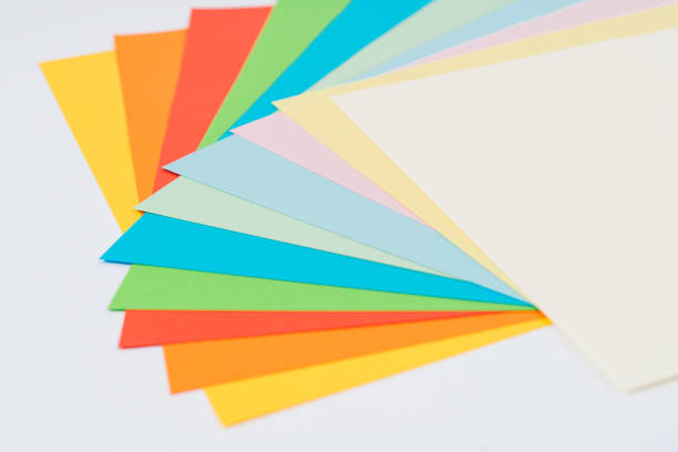 istock laid out bright multicolored paper on white background, flat lay 1306007319