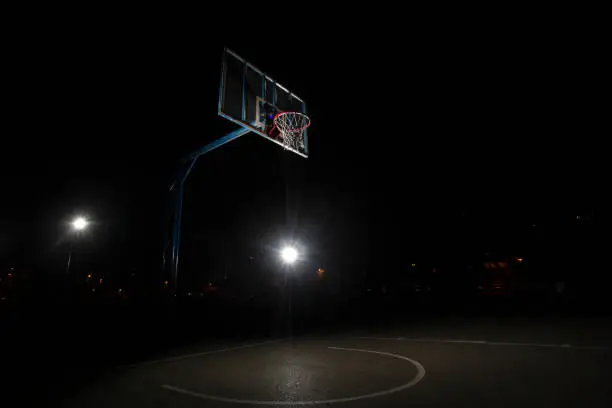 Photo of Basketball court at night