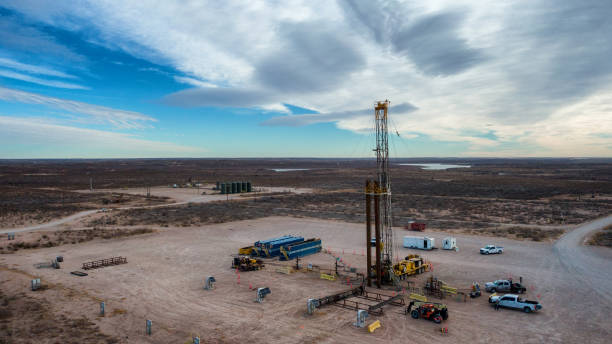 istock Drone View Of Oil Or Gas Drill Fracking Rig Pad With Dramatic Clouds in the Sky 1306008791