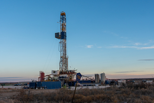 An Oil Or Gas Drill Fracking Rig Pad As The Sun Rises In New Mexico