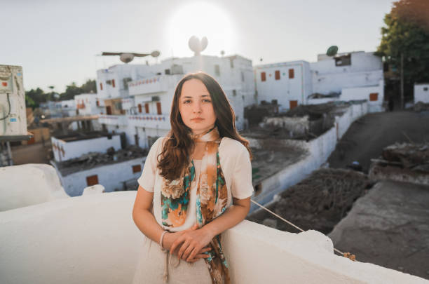 Young Caucasian woman  standing on terrace in Aswan