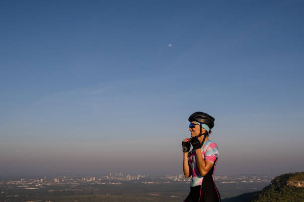 Young woman cycling in abstract VR environment. 3D generated image.