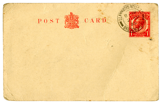 A postcard with a printed stamp showing King George V, dated 2nd September 1935 and posted in Llanwrtyd Wells in Breconshire, Wales. (Name and address removed.)