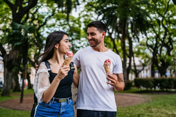 istock Happy couple eating ice cream 1306010979