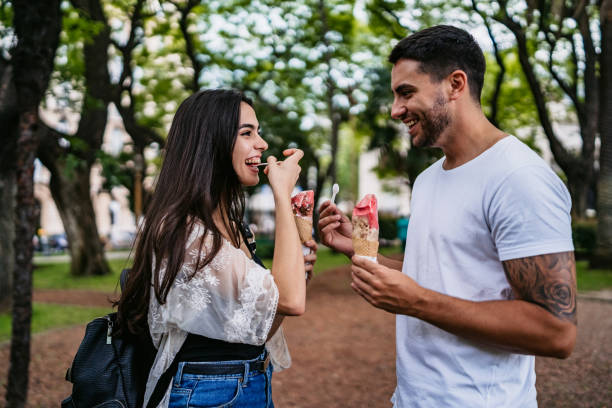 istock Happy couple eating ice cream 1306011022