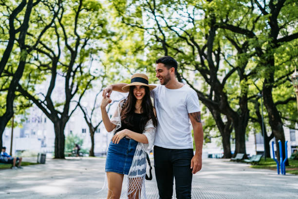 istock Young couple walking in park 1306011756