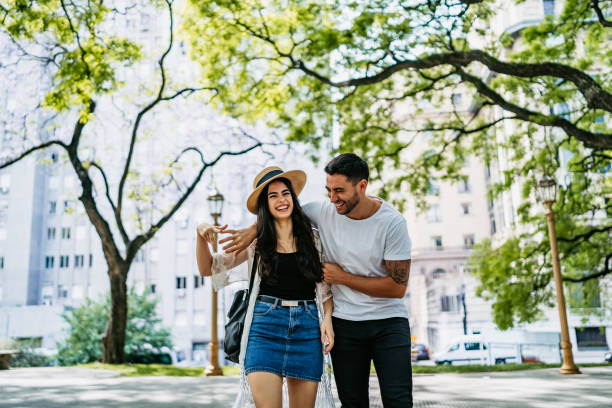 istock Young couple walking in park 1306011806