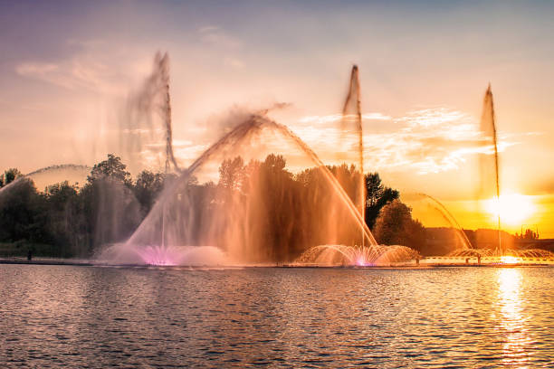 Picturesque sunset view on multimedia floating fountain on the Southern Buh River in Vinnytsia, Ukraine Picturesque sunset view on multimedia floating fountain on the Southern Buh River in Vinnytsia, Ukraine vinnytsia photos stock pictures, royalty-free photos & images