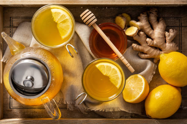 istock Ginger tea with lemon and honey in crystal glass 1306015101