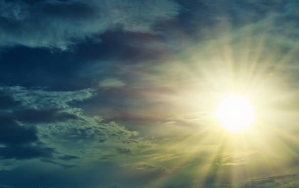 istock Bright sun in a beautiful cloudy sky. 1306017107