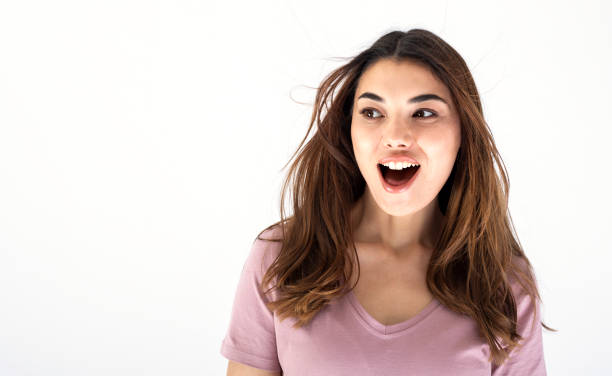 istock young beautiful woman surprised portrait 1306021241
