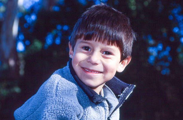 istock Close-up of Smiling Latino Wearing Grey Jacket 1306022070