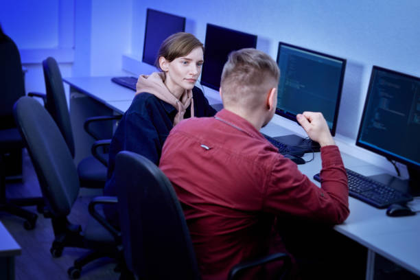 istock Two colleagues communicate and discuss the work. Esports player. Computer room. 1306022276