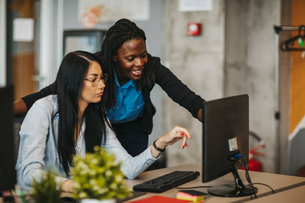 istock Businesswomen working together 1306025170