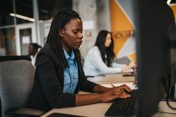 istock Female colleagues working in modern office 1306025376