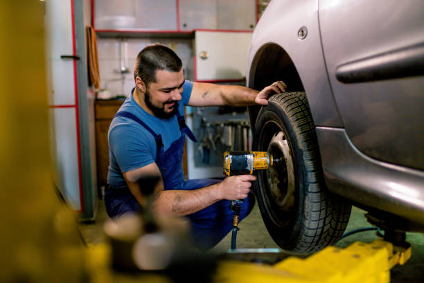 istock Tire changing at car service 1306025456