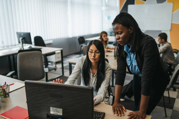 istock Young multi ethnic-group of people working in modern office 1306025458