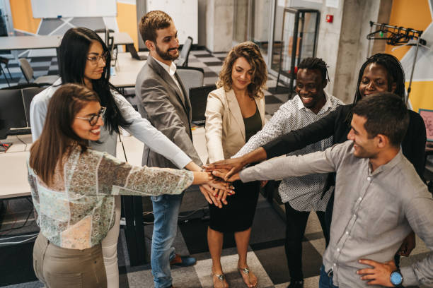 istock Happy multinational coworkers giving high five celebrating great teamwork result 1306025526