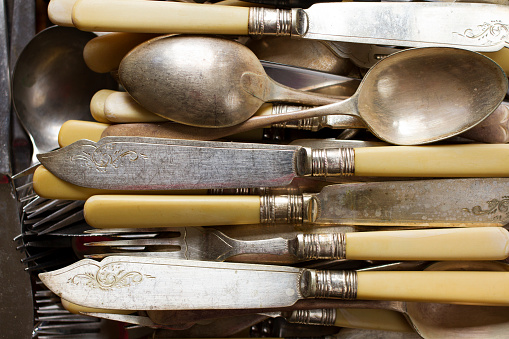 Colour photograph of antique English silver & ivory cutlery