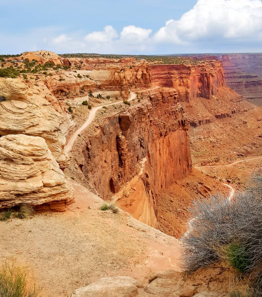 istock Trails on the edge of high steep cliff 1306030363