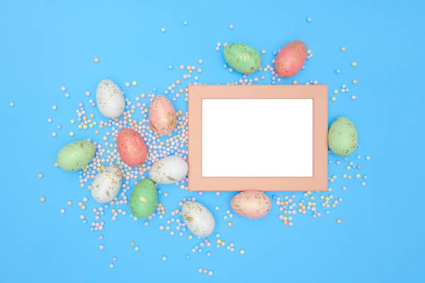 istock Flat lay image composition of Easter eggs, colorful foam balls. Modern minimal design template of postcard. Top view 1306031230