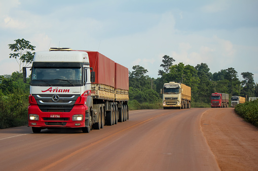 Trairao/Para/Brazil - Nov 27, 2017: Row of trucks transporting soy produced in Mato Grosso by BR-163 (Santarem-Cuiaba) to the port of Miritituba in Itaituba, state of Pará.