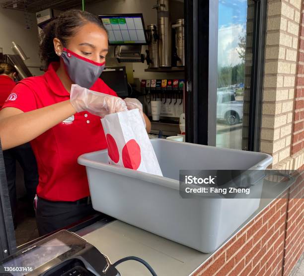 Chickfila Employee Servicing At Drivethrough Window Stock Photo - Download Image Now