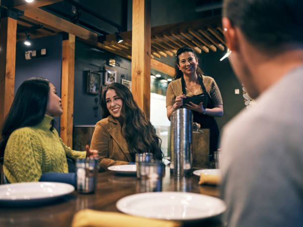 istock Multi Ethnic Group of Friends in an Indian Restaurant 1306032357