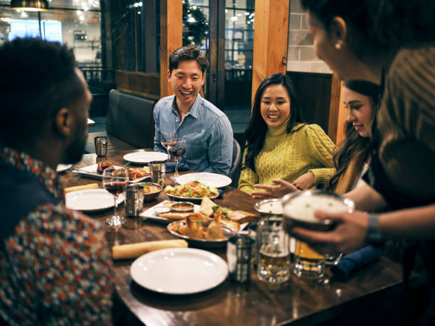 istock Multi Ethnic Group of Friends in an Indian Restaurant 1306032456