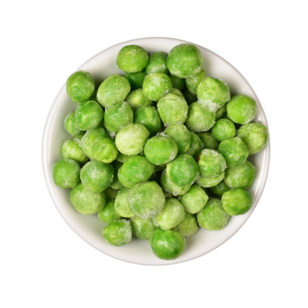 istock Frozen pea in bowl isolated on white background with clipping path 1306034230