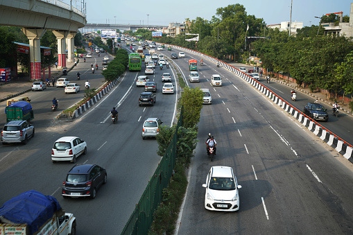 Traffic going on two lane road in new Delhi, India