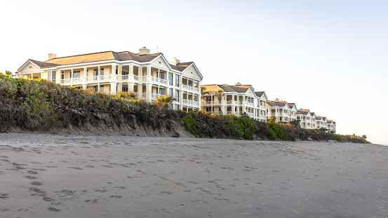 A newly constructed community of luxury condominiums just off the shoreline on Florida's east coast. This image was captured at sunset as viewed from the beach.