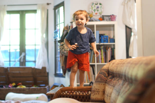 istock toddlers jumping on the couch 1306036753