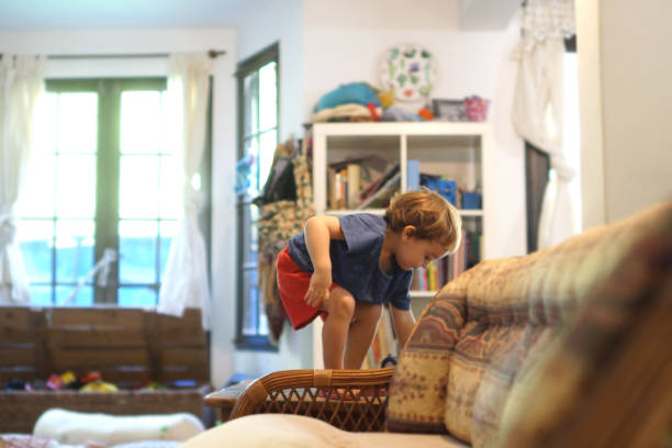 istock toddlers jumping on the couch 1306036782