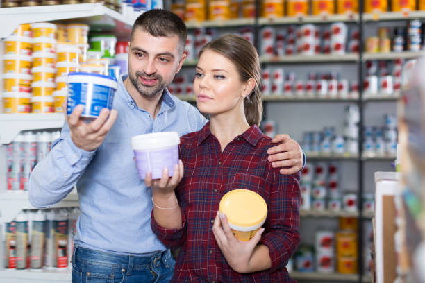 istock Two young designers are choosing paint for room 1306038495
