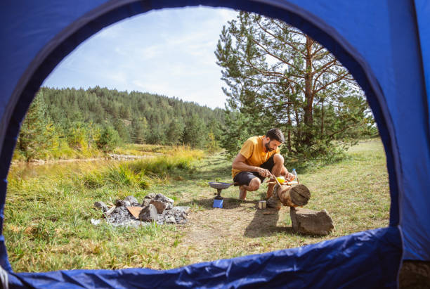 istock Enjoying the day in nature with blue tent 1306045739