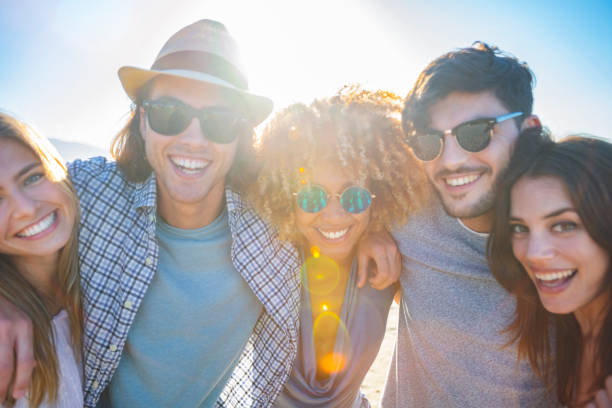 istock Group of friends having fun embracing. 1306047494