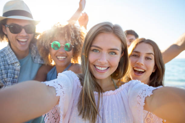 istock Group of friends having fun taking a selfie on the beach. 1306047499