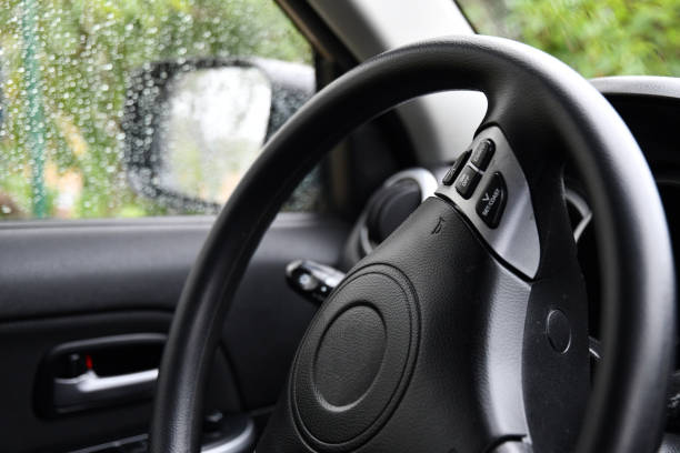 istock Closeup car steering wheel covered with black leather 1306049270