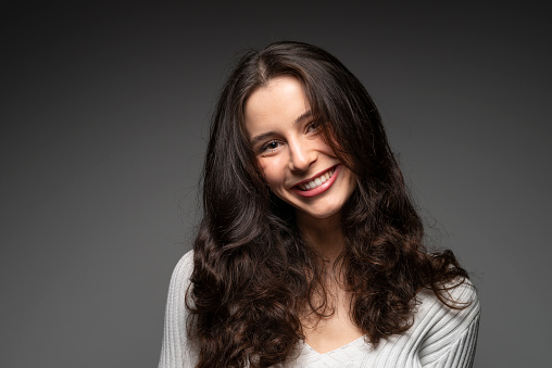 portrait of a young woman smiling at camera