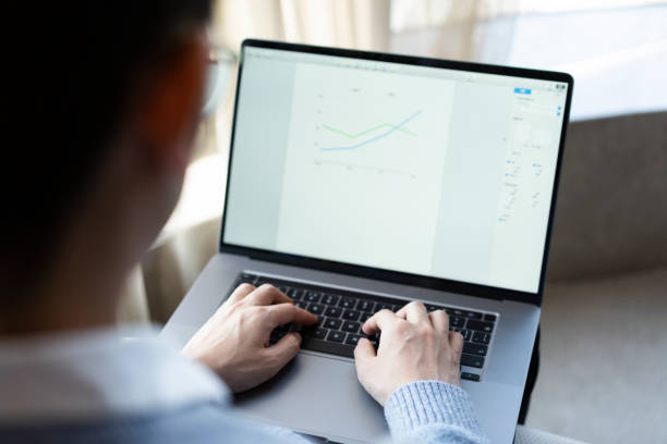 istock Asian businessman working at home with laptop 1306052120