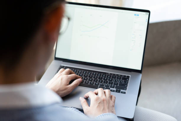 istock Asian businessman working at home with laptop 1306052158